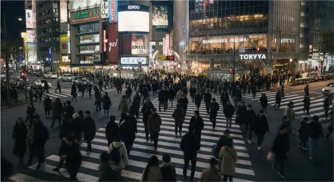 A Tokyo scramble crossing at night, cinematic street photography