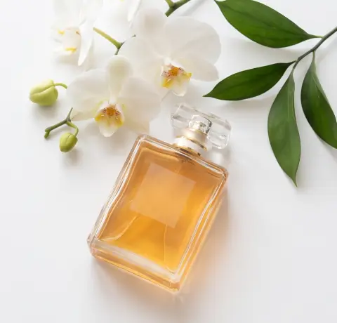 A luxury perfume bottle with flowers, luxury product photography, minimal composition